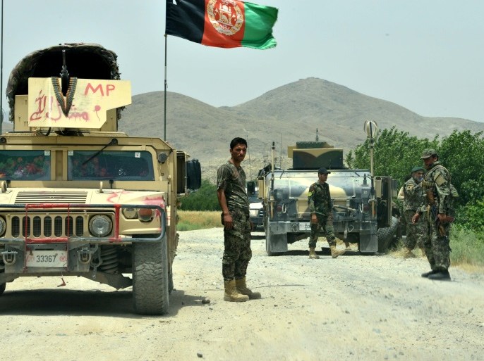 Afghan National Army (ANA) soldiers patrol the Shah Wali Kot district of Kandahar province on May 23, 2017.At least 10 Afghan soldiers were killed when militants attacked their army base in the southern province of Kandahar, the defence ministry said May 23, in the latest attack on Western-backed forces. / AFP PHOTO / JAVED TANVEER (Photo credit should read JAVED TANVEER/AFP/Getty Images)