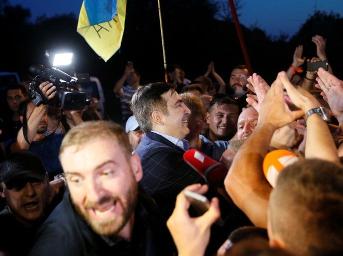 Former Georgian President Mikheil Saakashvili is welcomed by his supporters after he barged past guards to enter Ukraine from the Polish border, at a checkpoint in Shehyni, Ukraine September 10, 2017. REUTERS/Valentyn Ogirenko
