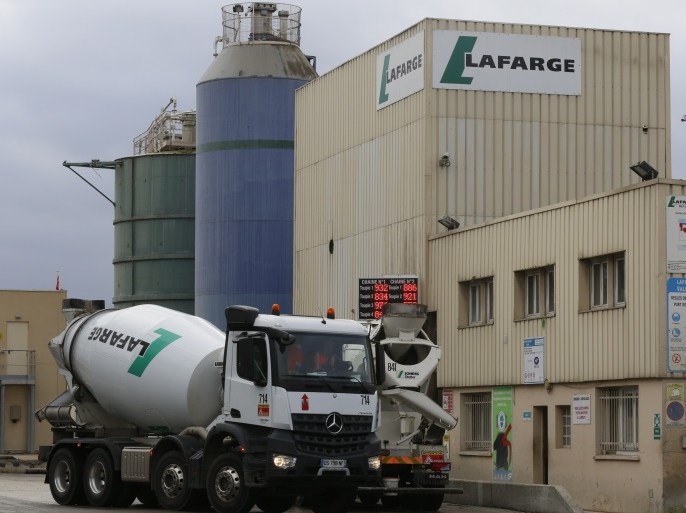 The logo of French building material Lafarge is seen on cement trucks at a production plant in Paris, France, February 22, 2016. In July 2015, Lafarge and Holcim have become one to create a new leader in building materials. REUTERS/Jacky Naegelen