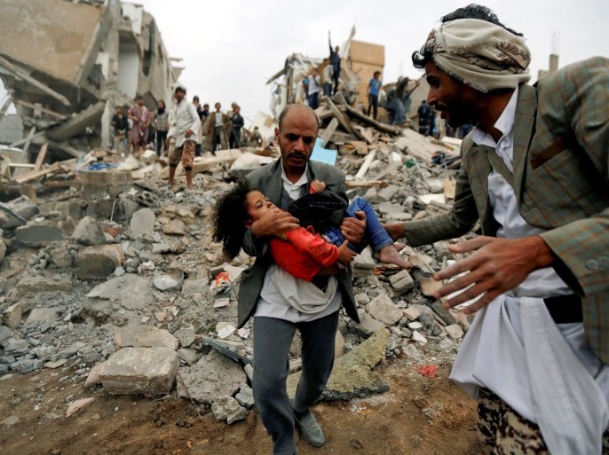 A man carries Buthaina Muhammad Mansour, believed to be four or five, rescued from the site of a Saudi-led air strike that killed eight of her family members in Sanaa, Yemen August 25, 2017. REUTERS/Khaled Abdullah/File Photo SEARCH