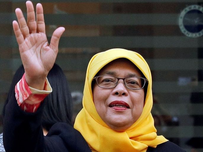 Former speaker of Singapore's parliament, Halimah Yacob, arrives at the Elections Department after she was given the certificate of eligibility to contest the election by the Presidential Elections Committee in Singapore September 11, 2017. REUTERS/Edgar Su