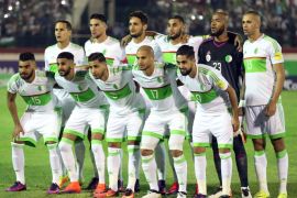 epa05578888 Algerian national soccer team players line up before the FIFA World Cup 2018 qualifying soccer match between Algeria and Cameroon at the Mustapha Tchaker Stadium in Blida south of Algiers, Algeria, 09 October 2016. EPA/STR
