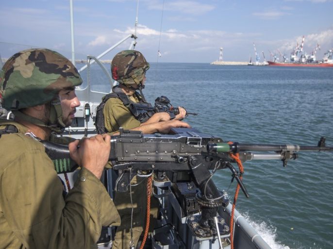Sailors with the Israeli navy look out over a port on a Dvora vessel as it leaves the port in Ashdod on November 17, 2014. Israel uses a fleet of Dvora and similar boats to prevent the smuggling of arms and goods into Gaza from Egypt, and secure Israel's offshore gas drilling rigs. AFP PHOTO / JACK GUEZ (Photo credit should read JACK GUEZ/AFP/Getty Images)