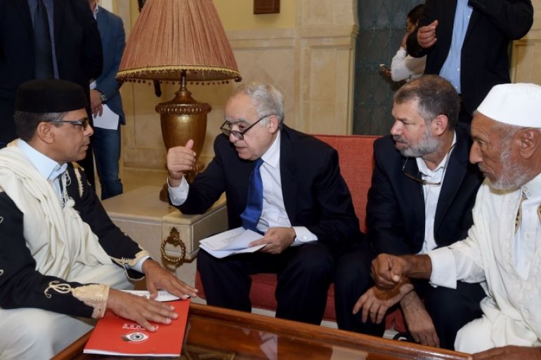 Ghassan Salame (C), special representative to the Secretary General of the United Nations for Libya, talks to the president of the supreme council of reconciliation, Mohamed Allouch (L), during a meeting with rival Libyan factions in the Tunisian capital Tunis on September 26, 2017. Neighboring Tunisia offered to act as a mediator between rival Libyan factions. Libya, which plunged into chaos after the ouster and killing of dictator Moamer Kadhafi in 2011, has two rival governments and parliaments, as well as several militia groups battling to control its oil wealth. / AFP PHOTO / FETHI BELAID (Photo credit should read FETHI BELAID/AFP/Getty Images)