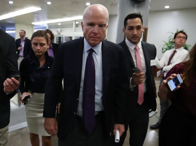WASHINGTON, DC - SEPTEMBER 18: Sen. John McCain (R-AZ) is trailed by reporters in the Senate Subway before the Senate takes up the National Defense Authorization Act for FY2018, on Capitol Hill September 18, 2017 in Washington, DC. The NDAA authorizes levels of defense spending. (Photo by Mark Wilson/Getty Images)