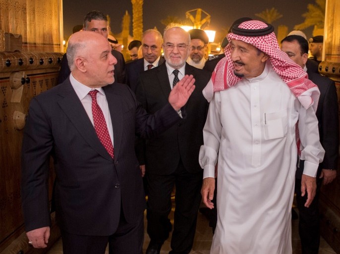 Saudi Arabia's King Salman bin Abdulaziz Al Saud welcomes Iraqi Prime Minister Haider Al-Abadi in Riyadh, Saudi Arabia October 21, 2017. Bandar Algaloud/Courtesy of Saudi Royal Court/Handout via REUTERS ATTENTION EDITORS - THIS PICTURE WAS PROVIDED BY A THIRD PARTY.