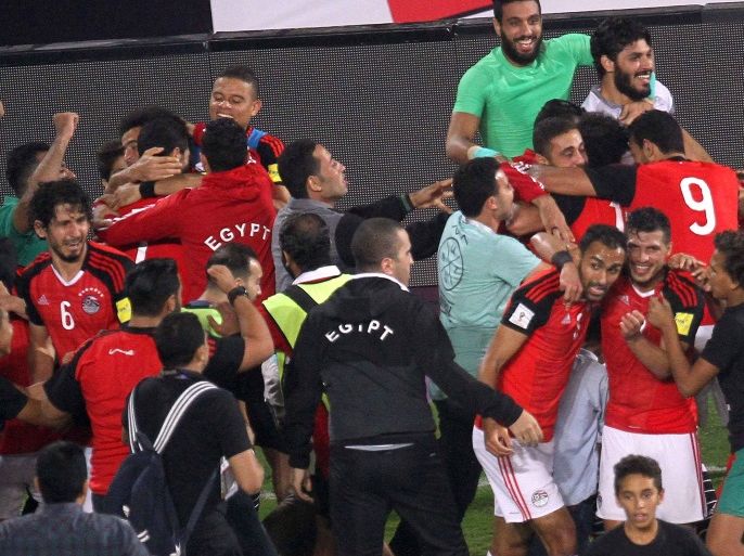 Egypt's team players celebrate wining against Congo's team during their World Cup 2018 Africa qualifying match between Egypt and Congo at the Borg el-Arab stadium in Alexandria on October 8, 2017.Liverpool striker Mohamed Salah converted a stoppage-time penalty to give Egypt a dramatic 2-1 win over Congo Brazzaville Sunday and a place at the 2018 World Cup in Russia. / AFP PHOTO / TAREK ABDEL HAMID (Photo credit should read TAREK ABDEL HAMID/AFP/Getty Images)