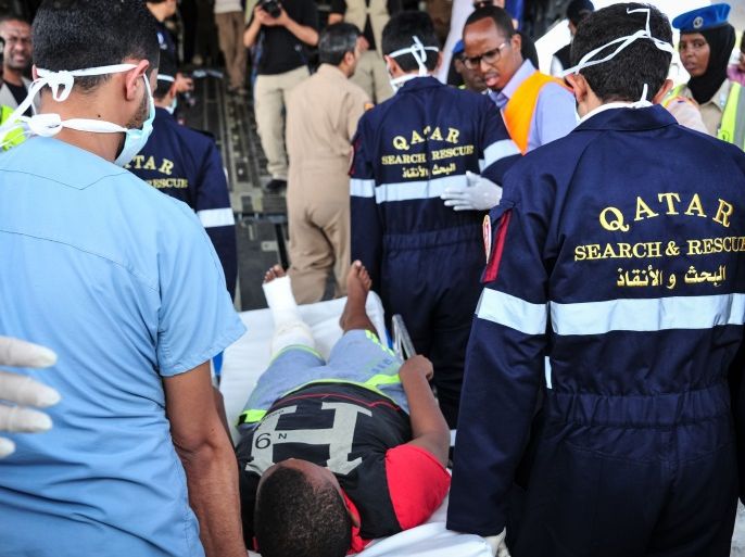 Qatari medical staff escort from an ambulance a Somalian wounded by the latest truck bomb attack in Mogadishu, before evacuating him by aircraft for treatment, at Aden Adde international airport in Mogadishu on October 17, 2017. At least 35 persons are evacuated to Kenya and Qatar on October 17, 2017 to receive treatment after the massive truck bomb attack in Mogadishu killed 276 people and left 300 injured, when a truck packed with explosives blew up in a busy commercial district. / AFP PHOTO / Mohamed ABDIWAHAB (Photo credit should read MOHAMED ABDIWAHAB/AFP/Getty Images)