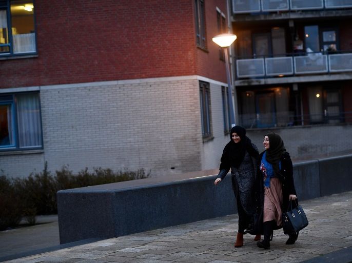 Muslim women walk through the streets near the Essalam Mosque in Rotterdam, Netherlands, March 10, 2017. The Dutch election takes place March 15. Picture taken March 10, 2017. REUTERS/Dylan Martinez