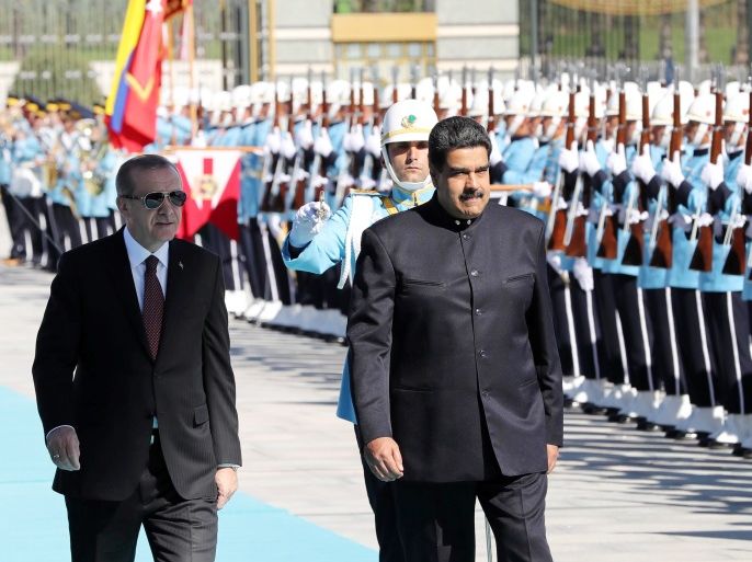 Venezuelan President Nicolas Maduro (R) and Turkish President Recep Tayyip Erdogan walk past honor guard during an official welcome ceremony, at Presidential Complex in Ankara, on October 6, 2017. / AFP PHOTO / ADEM ALTAN (Photo credit should read ADEM ALTAN/AFP/Getty Images)
