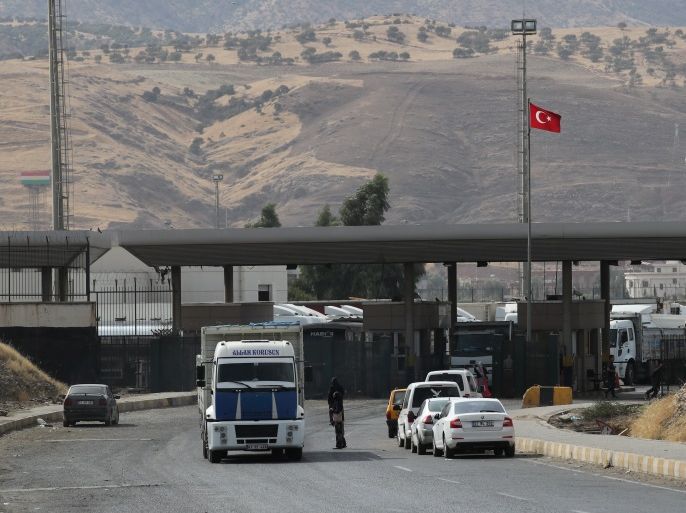 Trucks are pictured after crossing the border between Iraq and Turkey as vehicles wait in line to pass Habur border gate near Silopi, Turkey, September 25, 2017. REUTERS/Umit Bektas