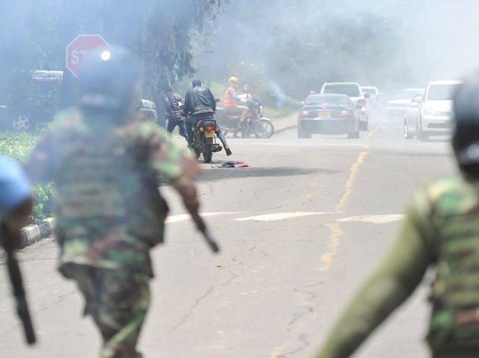 A man on a motorcycle scrambles to get away from police firing tear gas cannisters to disperse demonstrators on October 13, 2017, in Nairobi, as supporters of the opposition coalition National Super Alliance (NASA) took to the streets for the third day in a week.Hundreds of opposition supporters took to the streets of Kenya's main cities on October 13 in defiance of a government ban on protests as the country is gripped by uncertainty over its presidential election / AFP PHOTO / TONY KARUMBA (Photo credit should read TONY KARUMBA/AFP/Getty Images)