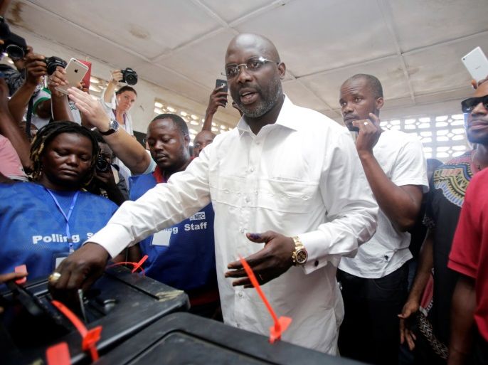 George Weah, former soccer player and presidential candidate of Congress for Democratic Change (CDC), votes at a polling station in Monrovia, Liberia, October 10, 2017. REUTERS/Thierry Gouegnon