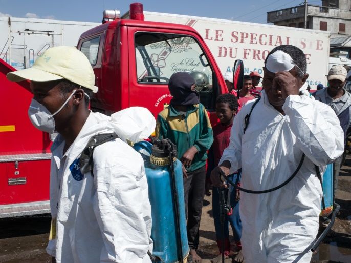 Council workers ready to start the clean-up operation of the market of Anosibe in the Anosibe district, one of the most unsalubrious district of Antananarivo on October 10, 2017.The World Health Organization has warned that a deadly outbreak of the plague, which began in late August, has claimed more than 20 lives in Madagascar and is swiftly spreading in cities across the country. Rats are porters of fleas which spread the bubonic plague and are attracted by garbages a