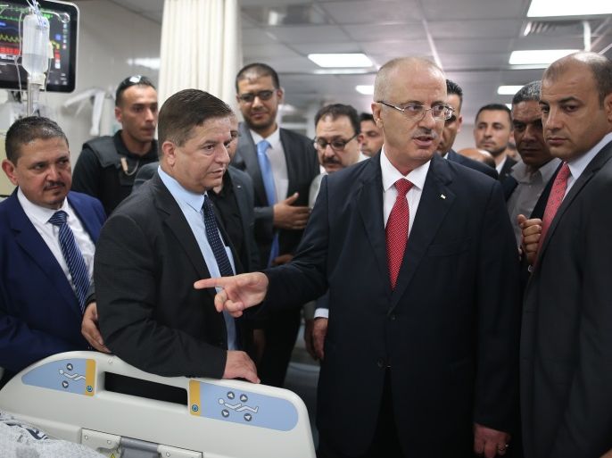 Palestinian prime minister Rami Hamdallah (2nd R) visits patients at Gaza City's Al-Shifa hospital on October 5, 2017.For three days it was all smiles as the Palestinian prime minister held talks in Gaza with Hamas but as the symbolic visit draws to a close the real work for reconciliation is just beginning. / AFP PHOTO / MOHAMMED ABED (Photo credit should read MOHAMMED ABED/AFP/Getty Images)