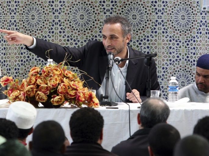 Author Tariq Ramadan gestures during a conference at the Er-Rahma mosque in Nantes, western France, April 25, 2010. Ramadan, a Swiss citizen of Egyptian origin who was born in Switzerland, has written extensively on Western Muslims and on Islam. He is president of the thinktank European Muslim Network in Brussels and teaches at Britain's Oxford University. REUTERS/Stephane Mahe (FRANCE - Tags: RELIGION)