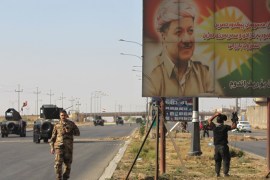 A banner bearing a portrait of Kurdish regional president Massoud Barzani is seen as Iraqi forces advance towards Kirkuk on October 16, 2017. Iraqi forces seized the Kirkuk governor's office, key military sites and an oil field as they swept across the disputed province following soaring tensions over an independence referendum. / AFP PHOTO / AHMAD AL-RUBAYE (Photo credit should read AHMAD AL-RUBAYE/AFP/Getty Images)