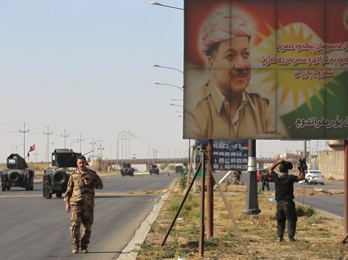 A banner bearing a portrait of Kurdish regional president Massoud Barzani is seen as Iraqi forces advance towards Kirkuk on October 16, 2017. Iraqi forces seized the Kirkuk governor's office, key military sites and an oil field as they swept across the disputed province following soaring tensions over an independence referendum. / AFP PHOTO / AHMAD AL-RUBAYE (Photo credit should read AHMAD AL-RUBAYE/AFP/Getty Images)