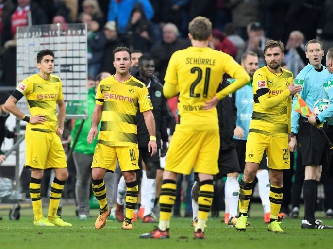 Soccer Football - Bundesliga - Hanover 96 vs Borussia Dortmund - HDI-Arena, Hanover, Germany - October 28, 2017 Borussia Dortmund’s Mario Gotze and Marcel Schmelzer (R) look dejected after the match REUTERS/Fabian Bimmer DFL RULES TO LIMIT THE ONLINE USAGE DURING MATCH TIME TO 15 PICTURES PER GAME. IMAGE SEQUENCES TO SIMULATE VIDEO IS NOT ALLOWED AT ANY TIME. FOR FURTHER QUERIES PLEASE CONTACT DFL DIRECTLY AT + 49 69 650050