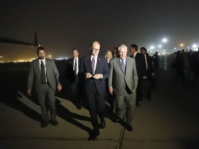 Secretary of State Rex Tillerson (R) walks on the tarmac following his arrival at Baghdad International Airport on October 23, 2017.US Secretary of State Rex Tillerson flew in to the Iraqi capital on a surprise visit for talks with Iraq's Prime Minister Haider al-Abadi and President Fuad Massum. / AFP PHOTO / POOL / Alex BRANDON (Photo credit should read ALEX BRANDON/AFP/Getty Images)