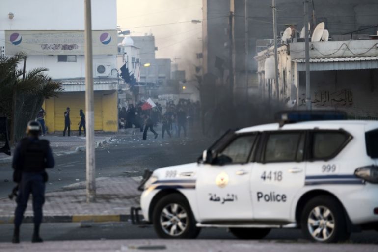 Bahraini protestors throw stones towards riot police during clashes following the funeral of Ali Abdulghani, 17, whose family says died of injuries suffered in a police chase, in the Shiite village of Shahrakkan, south of Manama on April 5, 2016. / AFP / MOHAMMED AL-SHAIKH (Photo credit should read MOHAMMED AL-SHAIKH/AFP/Getty Images)