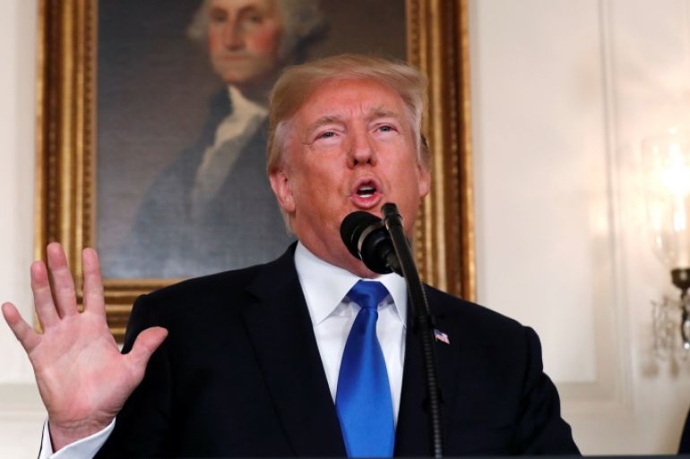 U.S. President Donald Trump speaks about Iran and the Iran nuclear deal in front of a portrait of President George Washington in the Diplomatic Room of the White House in Washington, U.S., October 13, 2017. REUTERS/Kevin Lamarque TPX IMAGES OF THE DAY
