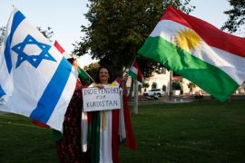 Members of the Kurdish Jewish community hold Israeli and Kurdish flags during a demonstration near the American consulate in Jerusalem on September 24, 2017, in support of the referendum on independence in Iraq's autonomous Kurdish region, the day before voting polls open. / AFP PHOTO / AHMAD GHARABLI (Photo credit should read AHMAD GHARABLI/AFP/Getty Images)