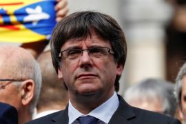 Catalan President Carles Puigdemont stands and other regional government members in Plaza Sant Jaume as they join a protest called by pro-independence groups for citizens to gather at noon in front of city halls throughout Catalonia, in Barcelona, Spain October 2, 2017. REUTERS/Juan Medina