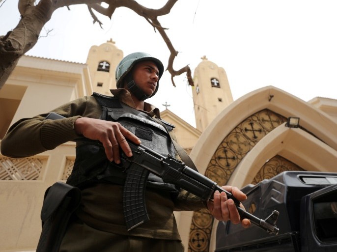 FILE PHOTO: An armed policeman secures the Coptic church that was bombed in Tanta, Egypt April 10, 2017. To match Special Report EGYPT-POLITICS/SINAI REUTERS/Mohamed Abd El Ghany/File Photo