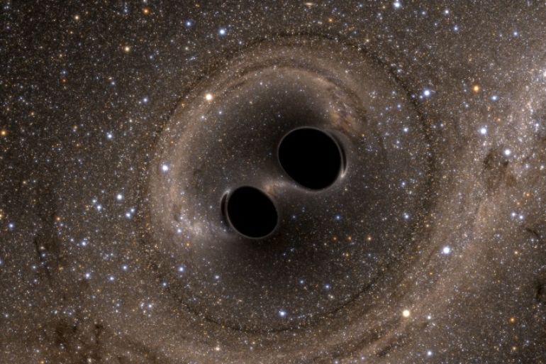 The collision of two black holes - a tremendously powerful event detected for the first time ever by the Laser Interferometer Gravitational-Wave Observatory, or LIGO - is seen in this still image from a computer simulation released in Washington February 11, 2016. Scientists have for the first time detected gravitational waves, ripples in space and time hypothesized by Albert Einstein a century ago, in a landmark discovery announced on Thursday that opens a new window