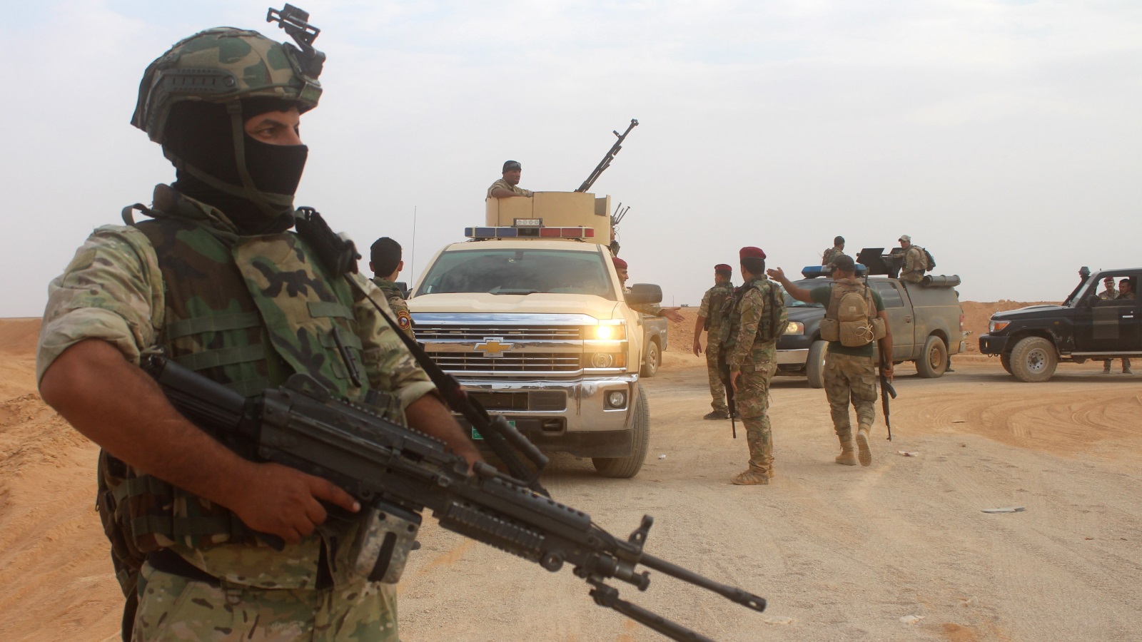 ‪القوات العراقية تسعى لتطهير المناطق الحدودية مع سوريا من عناصر تنظيم الدولة‬ القوات العراقية تسعى لتطهير المناطق الحدودية مع سوريا من عناصر تنظيم الدولة (غيتي)