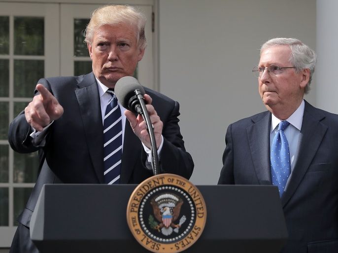 WASHINGTON, DC - OCTOBER 16: U.S. President Donald Trump (L) calls on reporters with Senate Majority Leader Mitch McConnell (R-KY) in the Rose Garden following a lunch meeting at the White House October 16, 2017 in Washington, DC. Trump and McConnell tried to erase reporting that they were not on the same page with the GOP legislative agenda and priorities. (Photo by Chip Somodevilla/Getty Images)