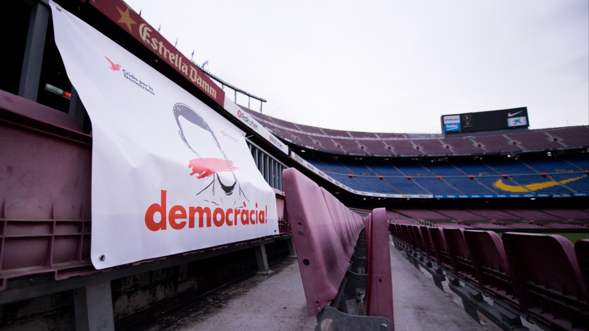 BARCELONA, SPAIN - OCTOBER 01:  A banner with the word 'Democracia', Catalan for 'Democracy', is seen in the stands of the stadium after the La Liga match between Barcelona and Las Palmas at Camp Nou on October 1, 2017 in Barcelona, Spain. The match has been played with empty stands after the events occured in Catalonia during the voting of a Catalonia independence referendum declared illegal and undemocratic by the Spanish government.  (Photo by Alex Caparros/Getty Images)