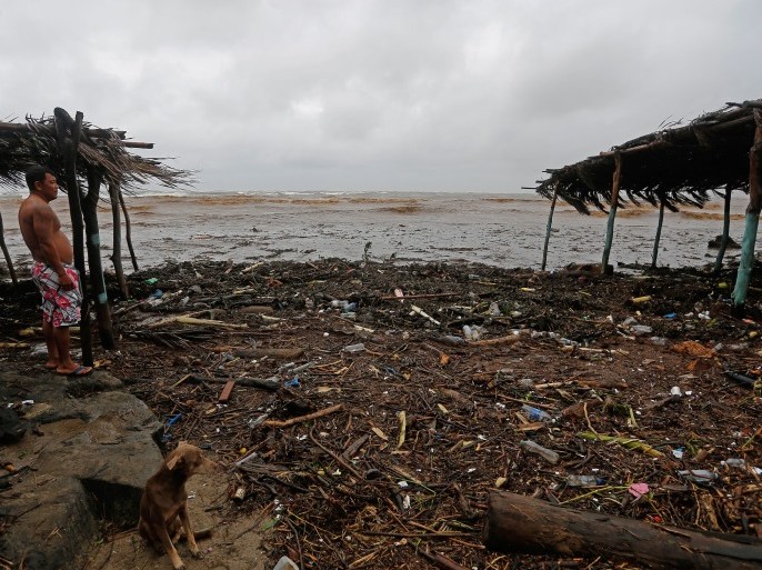 A resident watches the rising waves in Masachapa beach during heavy rains due to Tropical Storm Nate in the city of Masachapa, about 60km from the city of Managua on October 5, 2017.A tropical storm sliding north along Central America Thursday has unleashed heavy rains killing at least nine people in Costa Rica and Nicaragua, with forecasters predicting it could strengthen into a hurricane headed for the United States. / AFP PHOTO / INTI OCON (Photo credit should