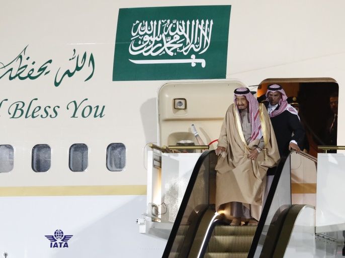 Saudi Arabia's King Salman (front) disembarks from a plane upon his arrival at Vnukovo airport outside Moscow, Russia October 4, 2017. REUTERS/Sergei Karpukhin