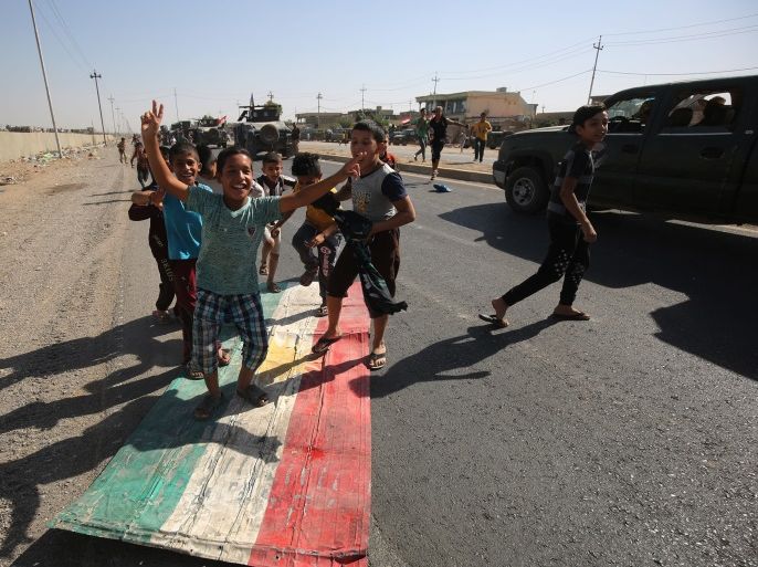 Iraqi children step on a Kurdish flag as forces advance towards the centre of Kirkuk during an operation against Kurdish fighters on October 16, 2017. Iraqi forces seized the Kirkuk governor's office, key military sites and an oil field as they swept across the disputed province following soaring tensions over an independence referendum. / AFP PHOTO / AHMAD AL-RUBAYE (Photo credit should read AHMAD AL-RUBAYE/AFP/Getty Images)