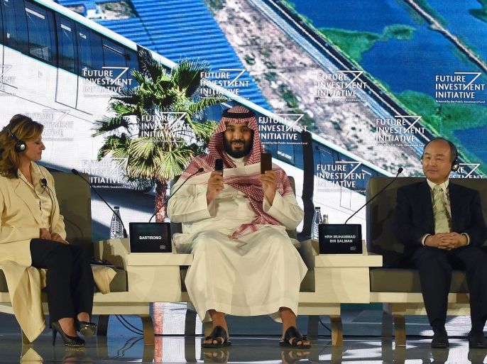 Saudi Crown Prince Mohammed bin Salman (C), US journalist Maria Bartiromo (L) and Masayoshi Son, the Chief Executive Officer of SoftBank, attend the Future Investment Initiative (FII) conference in Riyadh, on October 24, 2017.The Crown Prince pledged a 'moderate, open' Saudi Arabia, breaking with ultra-conservative clerics in favour of an image catering to foreign investors and Saudi youth. 'We are returning to what we were before -- a country of moderate Islam that