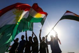 Iraqi Kurds wave flags of Iraqi Kurdistan during a demonstration outside the UN Office in Arbil, the capital of the autonomous region, on October 21, 2017, protesting against the escalating crisis with Baghdad. / AFP PHOTO / SAFIN HAMED (Photo credit should read SAFIN HAMED/AFP/Getty Images)