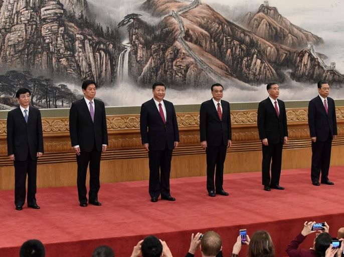 The Communist Party of China's new Politburo Standing Committee, the nation's top decision-making body (L-R) Han Zheng, Wang Huning, Li Zhanshu, Chinese President Xi Jinping, Premier Li Keqiang, Wang Yang, Zhao Leji meet the press at the Great Hall of the People in Beijing on October 25, 2017.China on October 25 unveiled its new ruling council with President Xi Jinping firmly at the helm after stamping his authority on the country by engraving his name on the Communist Party's constitution. / AFP PHOTO / WANG ZHAO (Photo credit should read WANG ZHAO/AFP/Getty Images)