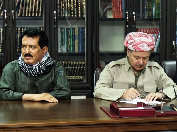 A file picture taken on September 12, 2017 shows Iraq's Kurdistan region president Massud Barzani (C) attending a meeting with Kirkuk provincial Governor Najim al-Din Karim (R), first Deputy for the Secretary General of the Patriotic Union of Kurdistan (PUK) party Kosrat Rasoul Ali (L), Peshmerga commander Jaafar Sheikh Mustafa (R), and other Peshmerga and Kurdish party leaders in the northern Iraqi city of Kirkuk. A Baghdad court on October 19, 2017, issued an arrest warrant for the vice president of Iraqi Kurdistan, Kosrat Rasul, on charges of 'provocation' against Iraq's armed forces, the judiciary said. / AFP PHOTO / MARWAN IBRAHIM (Photo credit should read MARWAN IBRAHIM/AFP/Getty Images)
