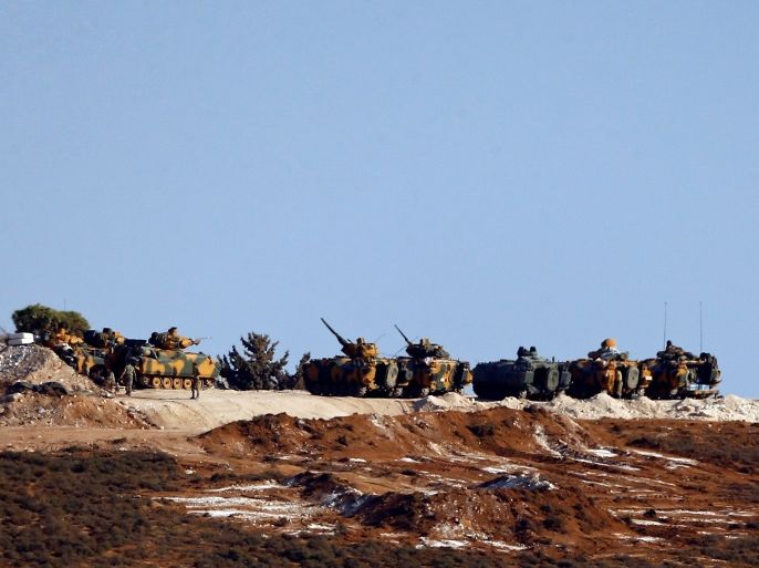 Turkish military vehicles are seen on the Turkish-Syrian border line in Reyhanli, Hatay province, Turkey, October 13, 2017. REUTERS/Osman Orsal