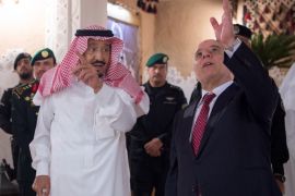 Saudi Arabia's King Salman bin Abdulaziz Al Saud (L) gestures as he welcomes Iraqi Prime Minister Haider Al-Abadi in Riyadh, Saudi Arabia October 21, 2017. Bandar Algaloud/Courtesy of Saudi Royal Court/Handout via REUTERS ATTENTION EDITORS - THIS PICTURE WAS PROVIDED BY A THIRD PARTY.