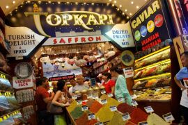 Tourists from Kazakhstan and Russia shop at a store at the Spice market, also known as the Egyptian Bazaar, in Istanbul August 23, 2013. REUTERS/Murad Sezer/File Photo