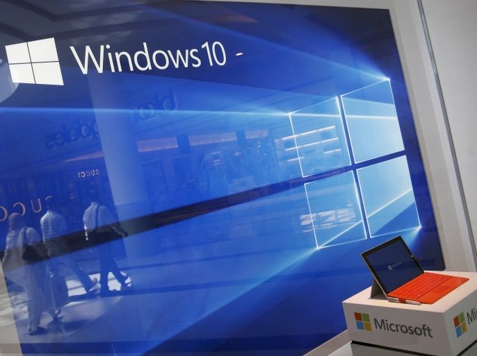 A display for the Windows 10 operating system is seen in a store window at the Microsoft store at Roosevelt Field in Garden City, New York July 29, 2015. Microsoft Corp's launch of its first new operating system in almost three years, designed to work across laptops, desktop and smartphones, won mostly positive reviews for its user-friendly and feature-packed interface.REUTERS/Shannon Stapleton