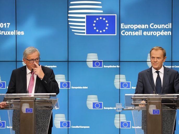 BRUSSELS, BELGIUM - OCTOBER 19: President of the European Council Donald Tusk, (R) and President of the European Commission Jean-Claude Juncker speak during a press conference after a European Council Meeting at the Council of the European Union building on October 19, 2017 in Brussels, Belgium. Britain's Prime Minister Theresa May attended along with the other 27 members Heads of State. Under discussion were the Iran Nuclear Deal, Brexit and North Korea. Mrs May offered assurances to EU nationals that her government will make it as easy as possible to remain living in the United Kingdom after Brexit. (Photo by Dan Kitwood/Getty Images)
