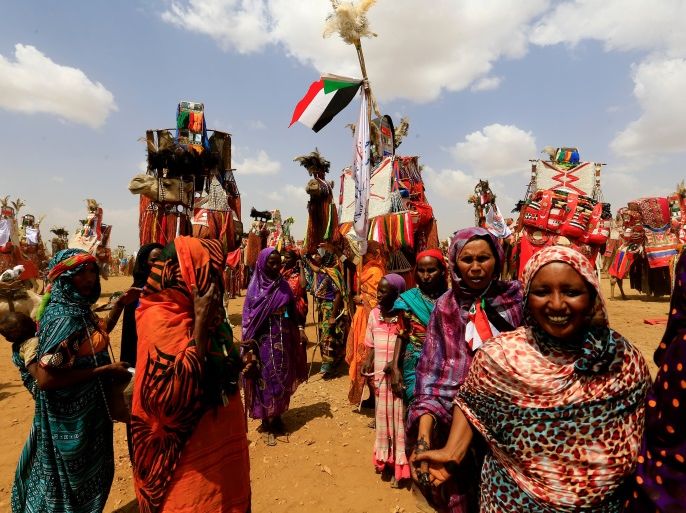 Women guide decorated camels during the visit of Sudanese President Omar al-Bashir to the war-torn Darfur region at Rapid Support Forces Headquarter in Umm Al-Qura, Darfur, Sudan September 23, 2017. REUTERS/Mohamed Nureldin Abdallah