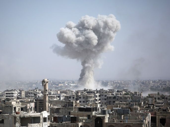 TOPSHOT - Smoke billows following a reported air strike by Syrian government forces in the rebel-held parts of the Jobar district, on the eastern outskirts of the Syrian capital Damascus, on August 9, 2017. / AFP PHOTO / Ammar SULEIMAN (Photo credit should read AMMAR SULEIMAN/AFP/Getty Images)