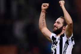 Juventus' forward Gonzalo Higuain from Argentina celebrates at the end of the Italian Serie A football match AC Milan Vs Juventus on October 28, 2017 at the 'Giuseppe Meazza' Stadium in Milan. / AFP PHOTO / MARCO BERTORELLO (Photo credit should read MARCO BERTORELLO/AFP/Getty Images)