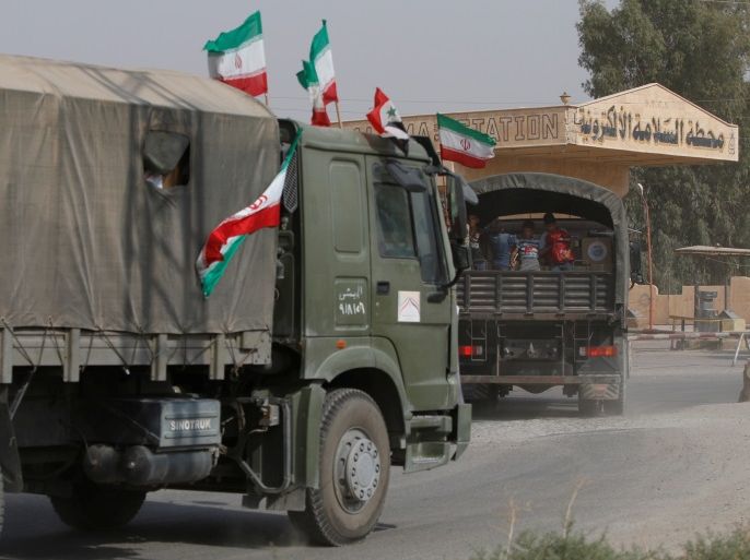 Iranian and Syrian flags flutter on a truck carrying humanitarian aid in Deir al-Zor, Syria September 20, 2017. Picture taken September 20, 2017. REUTERS/Omar Sanadiki