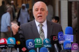 Iraqi Prime Minister Haider al-Abadi speaks to reporters after a meeting with the top Shiite cleric, Grand Ayatollah Ali al-Sistani, in the Shiite holy city of Najaf, south of Baghdad, October 20, 2014. REUTERS/Alaa Al-Marjani/File Photo